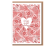 Red foliage with “Love you so much darling” in cutout heart