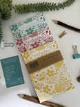 Set of 3 floral A6 notebooks (1 of each: red, yellow, aqua) “Nodiadau”